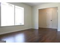 Inviting living room with hardwood floors and large windows that flood the space with natural light at 3647 Glen Mora Dr, Decatur, GA 30032