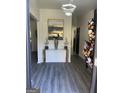 Elegant entryway featuring stylish decor, modern lighting, and sleek flooring at 7193 Cavender Sw Dr, South Fulton, GA 30331