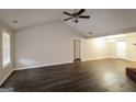 Open-concept living space with vaulted ceiling, seamlessly connecting living and dining areas at 136 Leguin Forest Dr, Locust Grove, GA 30248