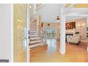 Elegant foyer with hardwood floors and a view of the staircase and living room at 643 Old Greenville Rd, Fayetteville, GA 30215