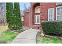 Close-up of the inviting brick entrance and landscaped walkway at 643 Old Greenville Rd, Fayetteville, GA 30215