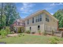 Two-story home featuring a spacious wooden deck and an open backyard perfect for outdoor activities at 140 Rockglen Ct, Fayetteville, GA 30215
