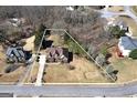 Expansive lot showcasing a well-maintained home with a spacious yard surrounded by mature trees at 149 Crown Glen Way, Stockbridge, GA 30281