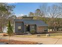 Charming home with a modern design, beautiful landscaping and curb appeal at 1190 Plantation Dr, Villa Rica, GA 30180