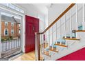 Elegant foyer with hardwood floors, a grand staircase, and a glimpse of the outdoors at 180 Habersham Pl, Fayetteville, GA 30214