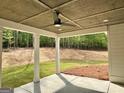 Inviting covered patio with ceiling fan, offering a serene outdoor space to relax and enjoy nature at 545 Discovery Lake Dr # 409, Fayetteville, GA 30215