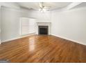 Bright living room featuring a fireplace and beautiful hardwood floors at 1832 Glenwood Ln, Snellville, GA 30078