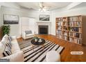 Inviting living room with fireplace, stylish decor, and plenty of natural light at 1832 Glenwood Ln, Snellville, GA 30078
