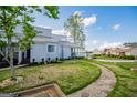 Townhome exterior showcasing lush lawn, stone pathway, and covered porch with scenic views at 277 Clearview Ct, Villa Rica, GA 30180