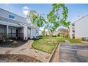 Townhome exterior with stone walkway, lush landscaping and neighboring townhomes at 277 Clearview Ct, Villa Rica, GA 30180