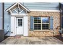 Inviting front entrance with white door, brick accents, and a welcoming welcome mat at 1045 Kirkland Cir, Smyrna, GA 30080