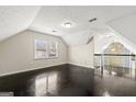 Open loft area featuring hardwood floors, neutral walls, natural light and views of the living room at 2840 Riverfront Dr, Snellville, GA 30039