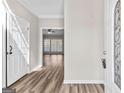 Bright foyer with hardwood floors and a glimpse of the spacious living area beyond at 821 Hood Rd, Fayetteville, GA 30214