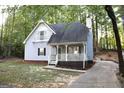 Charming two-story home with a lovely front porch and balcony at 142 Kylee Ct, Villa Rica, GA 30180