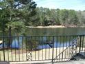 Breathtaking lake view from the property, featuring a tranquil body of water and lush greenery at 4228 Rocky Ledge Way, Snellville, GA 30039