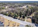 Residential property surrounded by mature trees near local highway at 2218 Young Rd, Stone Mountain, GA 30088