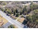 Residential property with mature trees bordering a roadway at 2218 Young Rd, Stone Mountain, GA 30088