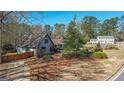 Inviting single-Gathering home featuring a well-manicured lawn and mature trees on an expansive lot at 101 Appleseed Ct, Peachtree City, GA 30269