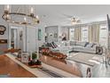 Open-concept living space featuring a dining area and spacious living room with fireplace and ample seating at 5135 Arnold St, Covington, GA 30014