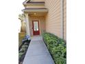 Covered front door and porch with brick accents and lush landscaping to the front sidewalk at 2478 Oakleaf Rdg, Lithonia, GA 30058