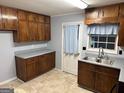 Classic kitchen with wood cabinets, updated countertops and neutral paint at 360 Meadowbrook Dr, Mcdonough, GA 30253