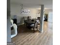 A modern dining room featuring a fireplace, wood floors, and stylish decor at 45 Fieldview Ln, Covington, GA 30016