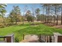 Expansive backyard with mature trees, offering a private and serene outdoor space at 2200 Gleneagle Nw Ct, Conyers, GA 30012