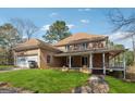 Lovely home with a large garage, expansive lawn, and covered porch perfect for outdoor living at 2200 Gleneagle Nw Ct, Conyers, GA 30012