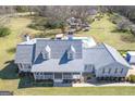 Aerial view of a home with a pool, lush greenery, and a well-maintained roof at 8 Cameron St, Moreland, GA 30259