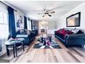 Bright living room with stylish decor, wood-look floors, and cozy seating area at 4436 Old Country Way, Snellville, GA 30039