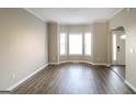 Inviting living room with large bay windows offering plenty of natural light and beautiful wood flooring at 5105 Cascade Hills Cir, Atlanta, GA 30331