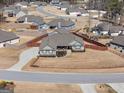 Aerial view of a fenced single-story home, nestled within a friendly residential neighborhood at 305 Cranmore Pl, Villa Rica, GA 30180