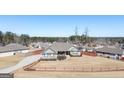 An aerial of a single-story home that features a cozy fenced yard in a quiet neighborhood at 305 Cranmore Pl, Villa Rica, GA 30180