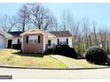 Inviting one-story home with vinyl siding, brick accents, trimmed bushes and leading sidewalk at 209 East Wilson St # 25, Villa Rica, GA 30180