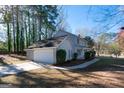 Well-maintained home with an attached two-car garage and a long driveway at 403 Sandown Dr, Peachtree City, GA 30269