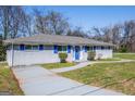 Single-story home with blue trim, including shutters and front door at 1393 Vesta Ave, Atlanta, GA 30344