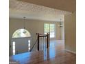 Bright foyer boasts hardwood floors, a staircase, and plenty of natural light at 4889 Wedgewood Way, Stone Mountain, GA 30088