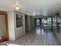 Relaxing sunroom with tile flooring and lots of windows providing ample sunlight at 4889 Wedgewood Way, Stone Mountain, GA 30088