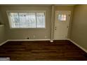 Cozy living room features beautiful wood floors, neutral walls, and a view to the outdoors at 1380 Margarette Dr, Decatur, GA 30035