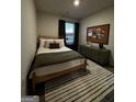 Comfortable bedroom featuring decoratively appointed furniture and a sunlit window at 237 Ivey Ter # 41, Temple, GA 30179