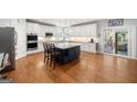 Open kitchen features a large island, stainless steel appliances, and ample cabinet space, flowing into an adjacent dining area at 3015 Gold Creek Dr, Villa Rica, GA 30180