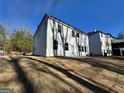 View of the backyard showing the home's exterior, with ample space for outdoor activities and relaxation at 3964 Riverchess Sw Dr # 157, Atlanta, GA 30331