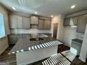 The kitchen features granite countertops, modern cabinetry and a large island perfect for cooking and entertaining at 3964 Riverchess Sw Dr # 157, Atlanta, GA 30331