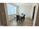 Bright dining room with a modern table set and a large window for natural light at 2780 Laurel Ridge Cir, East Point, GA 30344