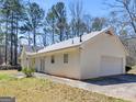 Spacious house with an attached garage and well maintained exterior at 290 Rocky Branch Dr, Mcdonough, GA 30252