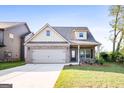 Charming single-Gathering home featuring a two-car garage, well-maintained lawn, and inviting curb appeal at 2389 Aukerman Trce # 79, Hampton, GA 30228