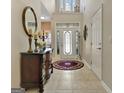 Inviting foyer featuring tile flooring and a decorative chest with mirror at 221 Collierstown Way, Peachtree City, GA 30269