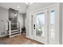Bright foyer with decorative glass door and staircase leading upstairs at 90 Oak Walk, Villa Rica, GA 30180