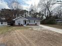Cozy home featuring a well-manicured front yard and a private driveway at 1643 Columbia Dr, Decatur, GA 30032