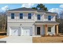 Charming two-story home with brick veneer, attached two-car garage, and a well-manicured front yard at 342 Overlook Rd, Walnut Grove, GA 30052